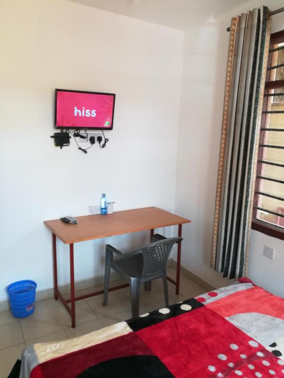TV a/nebo společenská místnost v ubytování Golden Guest House- Miritini