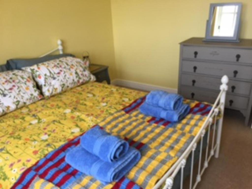 Ένα ή περισσότερα κρεβάτια σε δωμάτιο στο Stunning Lake District Cottage