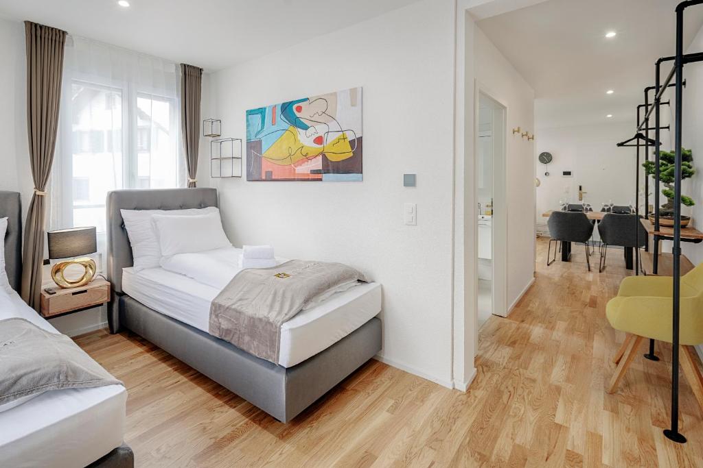 Postel nebo postele na pokoji v ubytování EH Apartments Jupiter