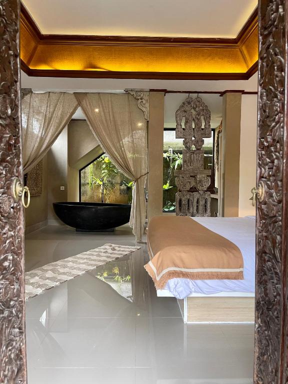 Postel nebo postele na pokoji v ubytování Chakra Living Ubud