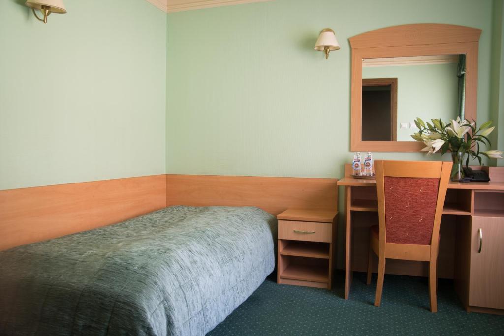 Postel nebo postele na pokoji v ubytování Hotel Pasymowski