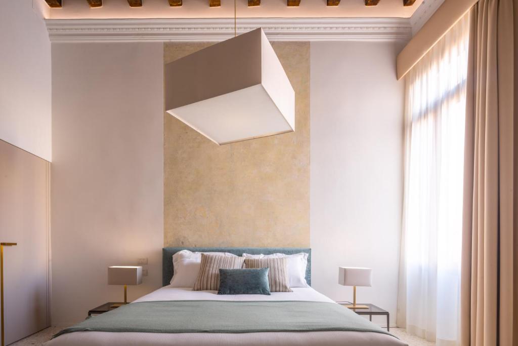 Postel nebo postele na pokoji v ubytování Ninfea Luxury Suites
