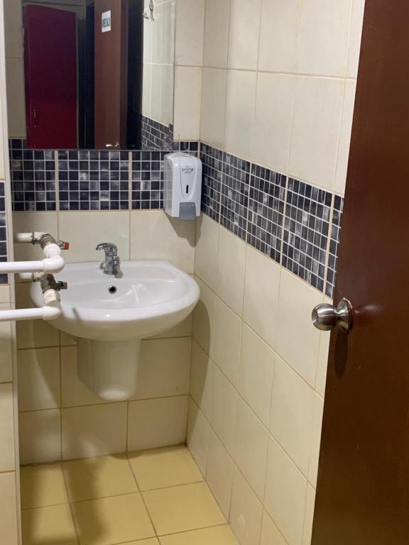 a bathroom with a sink and a mirror at Ankara apart hostel 3 in Altındağ