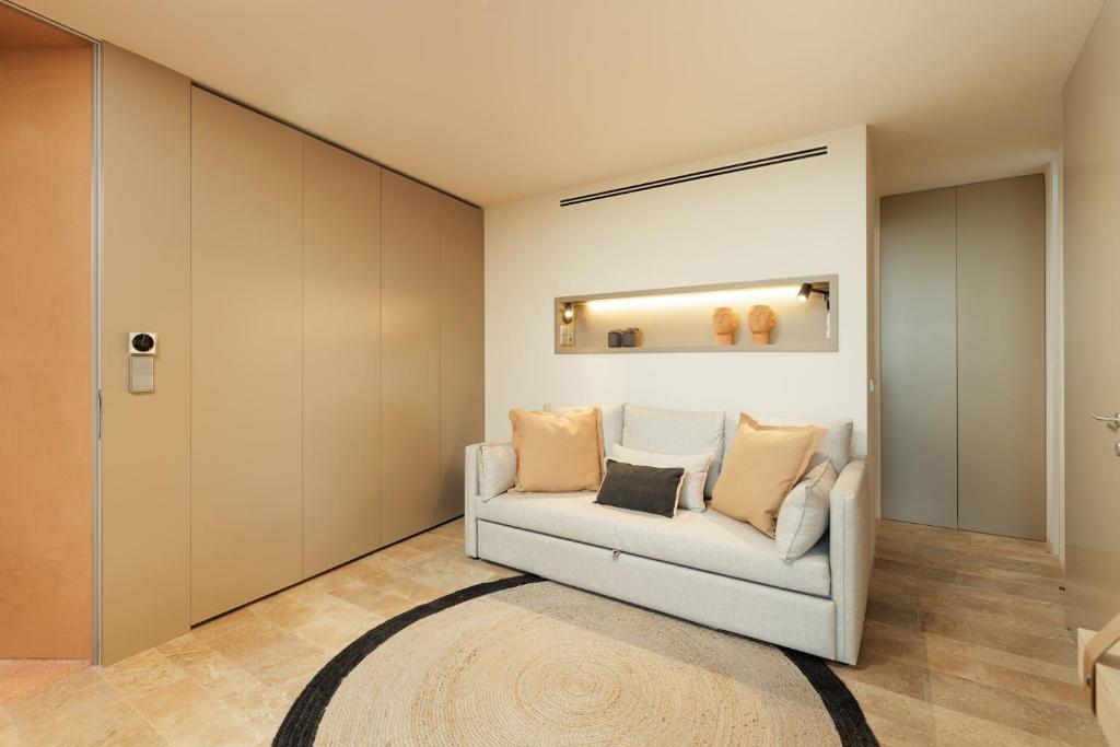 Postel nebo postele na pokoji v ubytování Palmares Signature Apartments