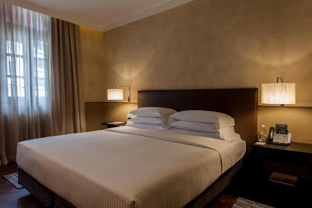 Postel nebo postele na pokoji v ubytování Hotel Fasano Salvador