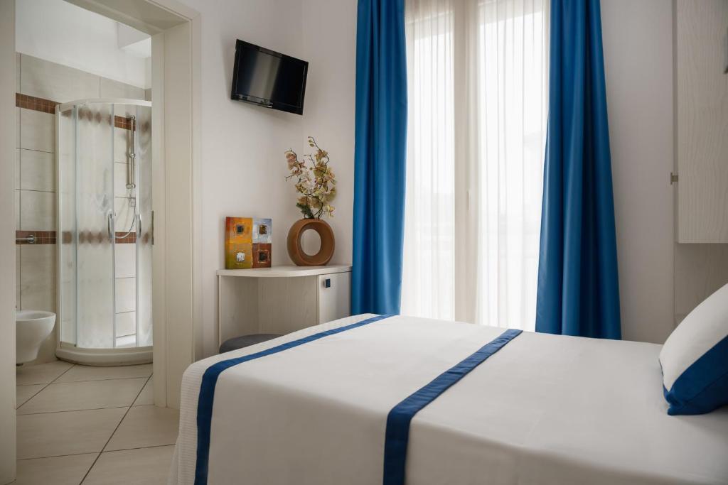 Postel nebo postele na pokoji v ubytování Hotel Embassy