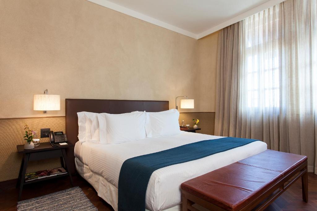 Postel nebo postele na pokoji v ubytování Hotel Fasano Salvador