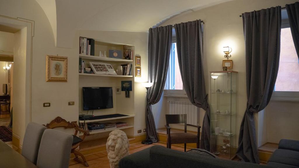 a living room with a couch and a tv at MGPGroup Guest House Piazza Navona in Rome