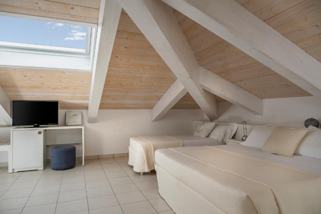 Postel nebo postele na pokoji v ubytování Hotel Embassy