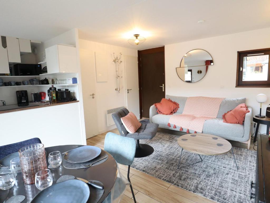 a living room with a couch and a table at Appartement Les Gets, 3 pièces, 4 personnes - FR-1-623-292 in Les Gets