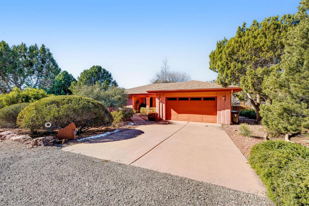 a house with a garage and a driveway at Sedona Sunbeam in Sedona
