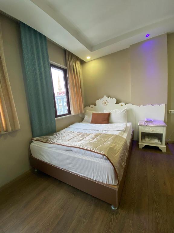 Postel nebo postele na pokoji v ubytování Hotel Kent Ani