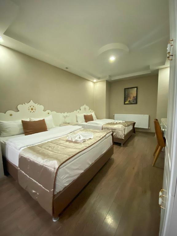 Postel nebo postele na pokoji v ubytování Hotel Kent Ani