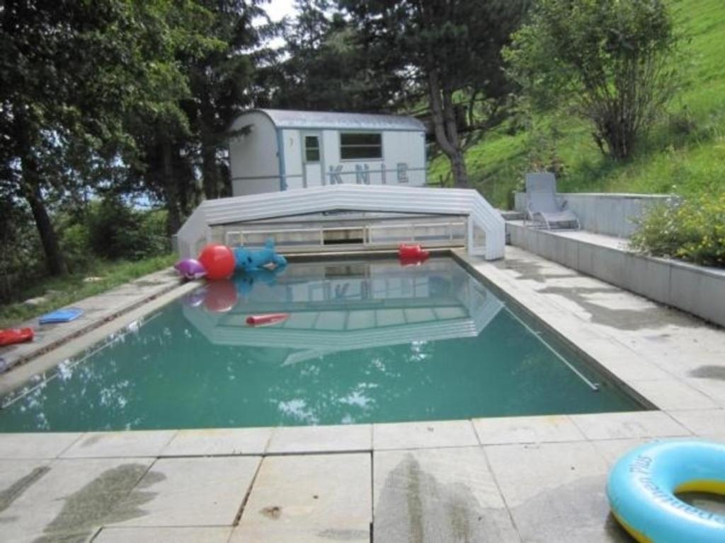 a small swimming pool with a inflatable at Ferienhaus Staudenhof Naturnah und idylisch in Präz