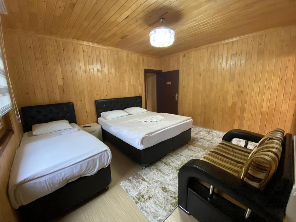Postel nebo postele na pokoji v ubytování Yüce Suite