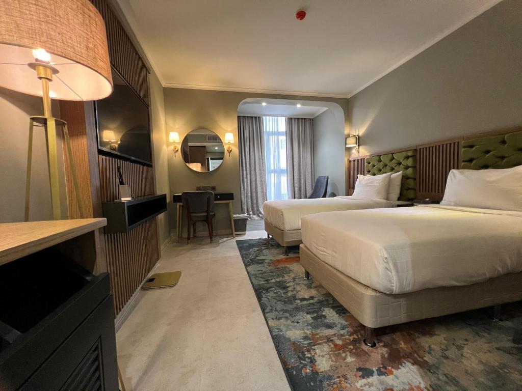 Postel nebo postele na pokoji v ubytování President Hotel