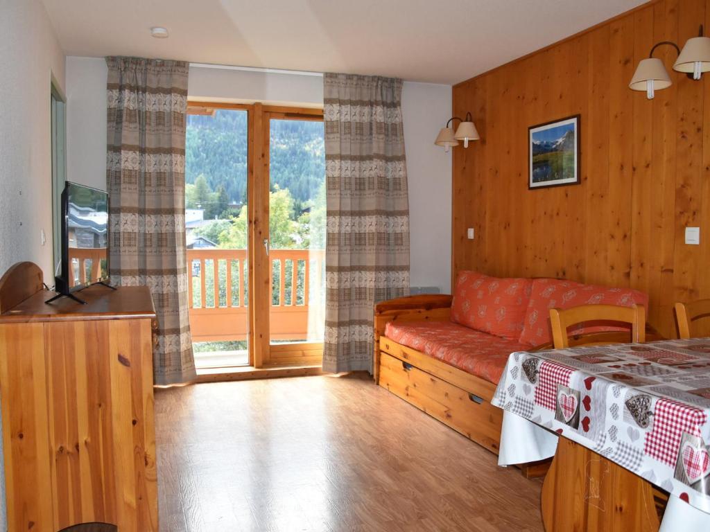 Μια τηλεόραση ή/και κέντρο ψυχαγωγίας στο Appartement cosy avec piscine, proche centre et téléphérique - 4 pers. - FR-1-464-165