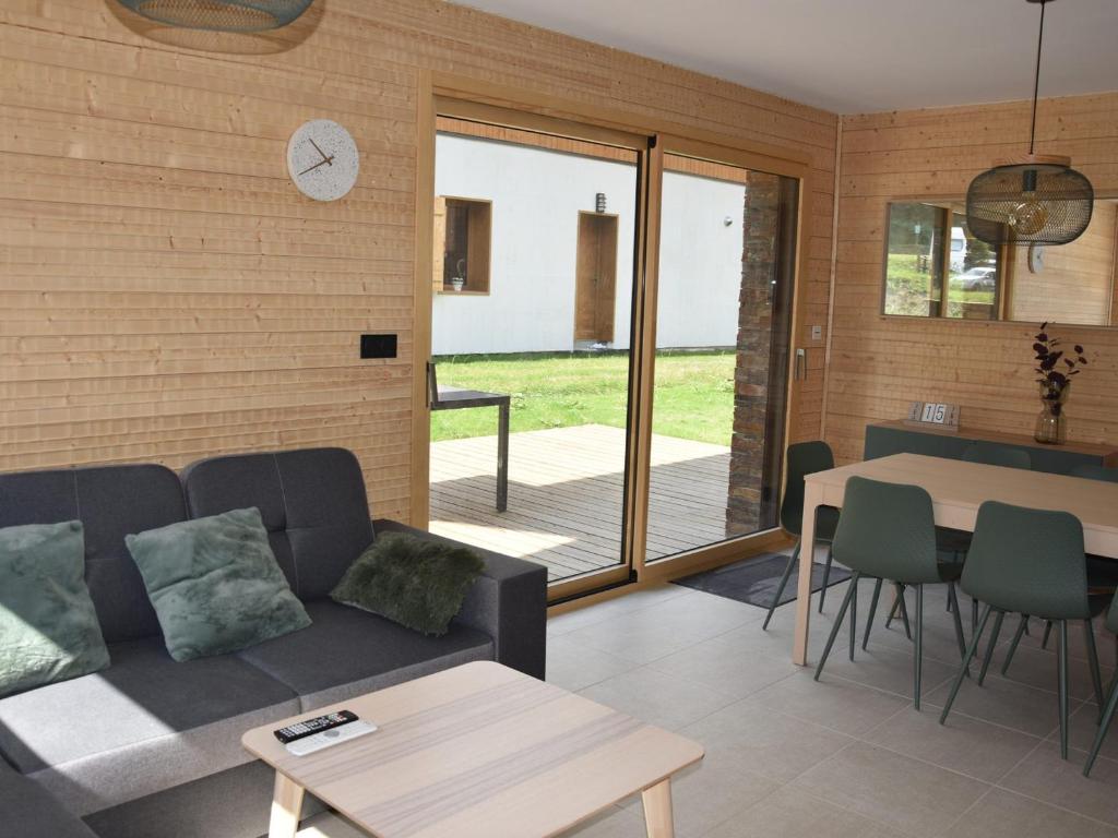 a living room with a couch and a table at Chalet Pralognan-la-Vanoise, 4 pièces, 8 personnes - FR-1-464-188 in Pralognan-la-Vanoise