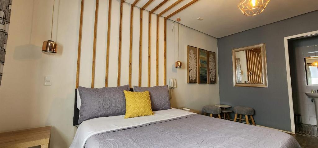 Postel nebo postele na pokoji v ubytování Hotel Voila la Moneda