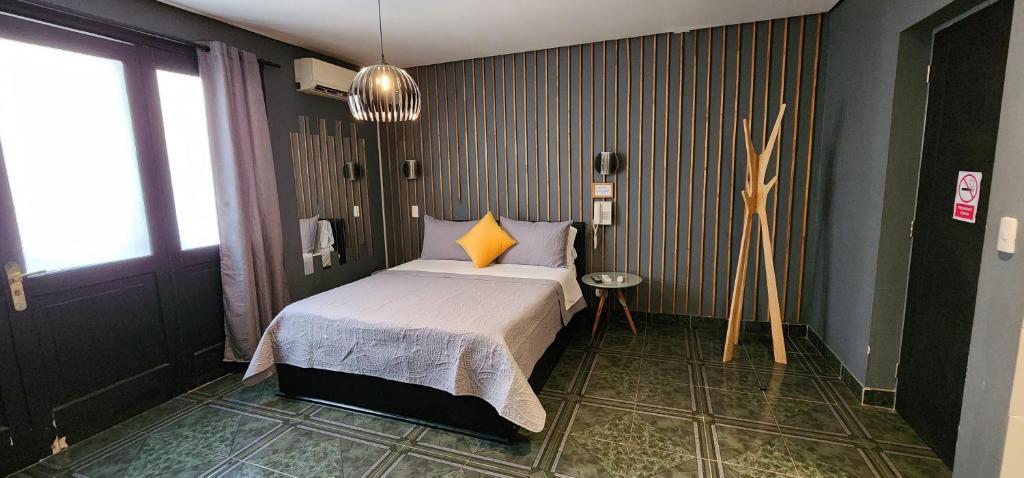 Postel nebo postele na pokoji v ubytování Hotel Voila la Moneda
