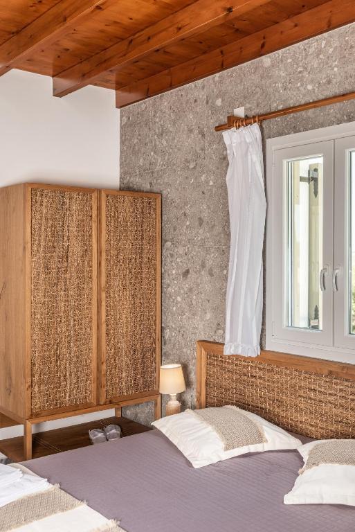 Postel nebo postele na pokoji v ubytování Sophia's Ralaki Cottage