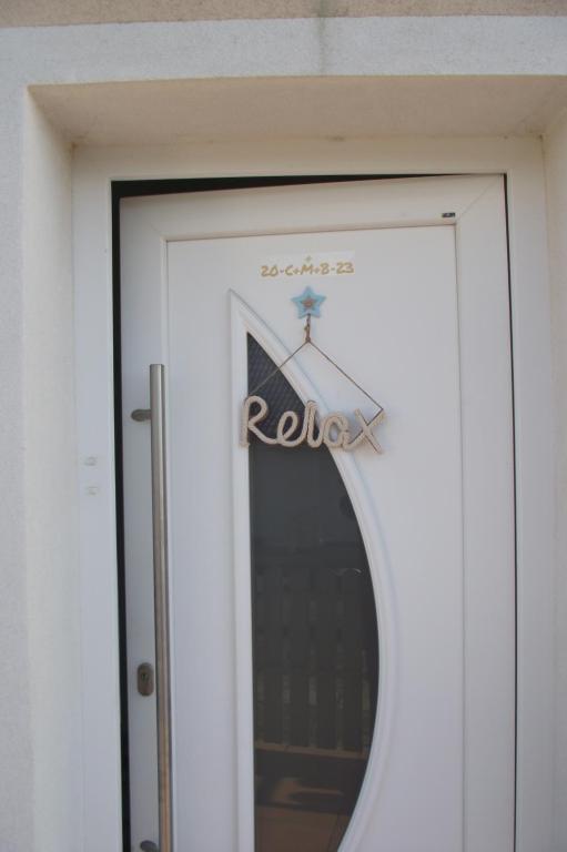 a sign on the door of a building at Relax Appartement in Bad Radkersburg