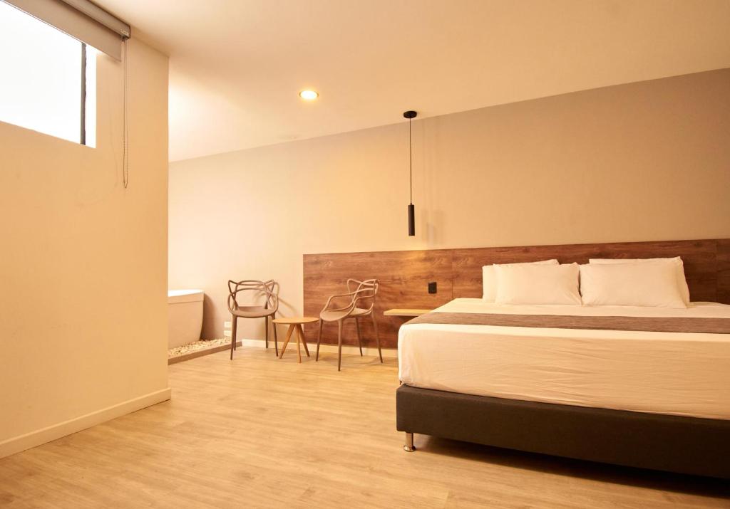 Posteľ alebo postele v izbe v ubytovaní HOTEL FENCE