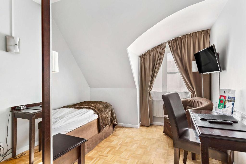 TV a/nebo společenská místnost v ubytování Vimmerby Stadshotell, WorldHotels Crafted