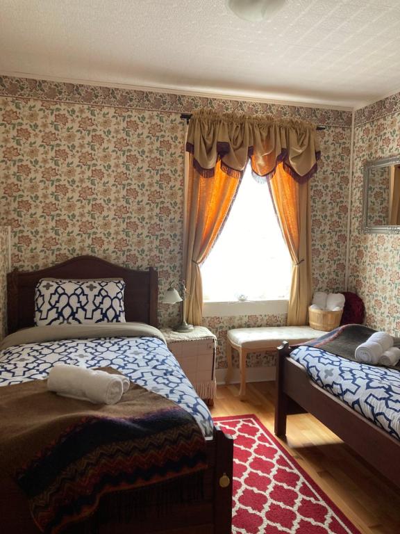 Postel nebo postele na pokoji v ubytování St. George Hotel