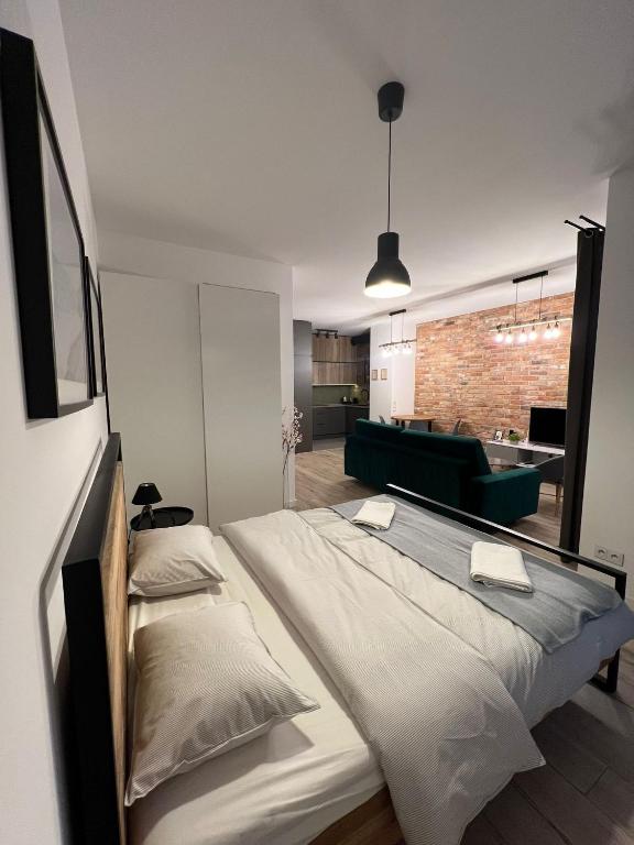 Posteľ alebo postele v izbe v ubytovaní Apartament WARSZAWA Kolejowa HUB EXPO