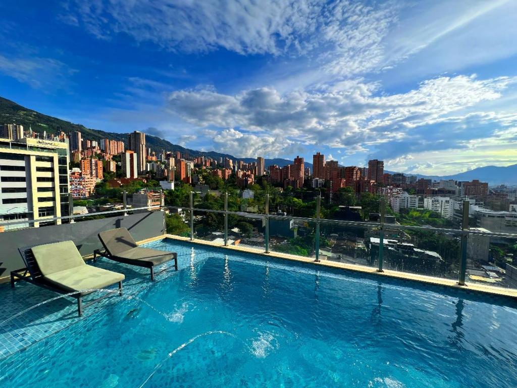 a large swimming pool on top of a building at Haven A Design Hotel in Medellín