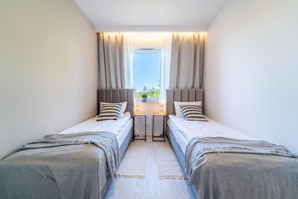 Posteľ alebo postele v izbe v ubytovaní Unique View Apartment - 3pok, 4 łóżka, widok na rzekę, centrum, Netflix, parking, winda