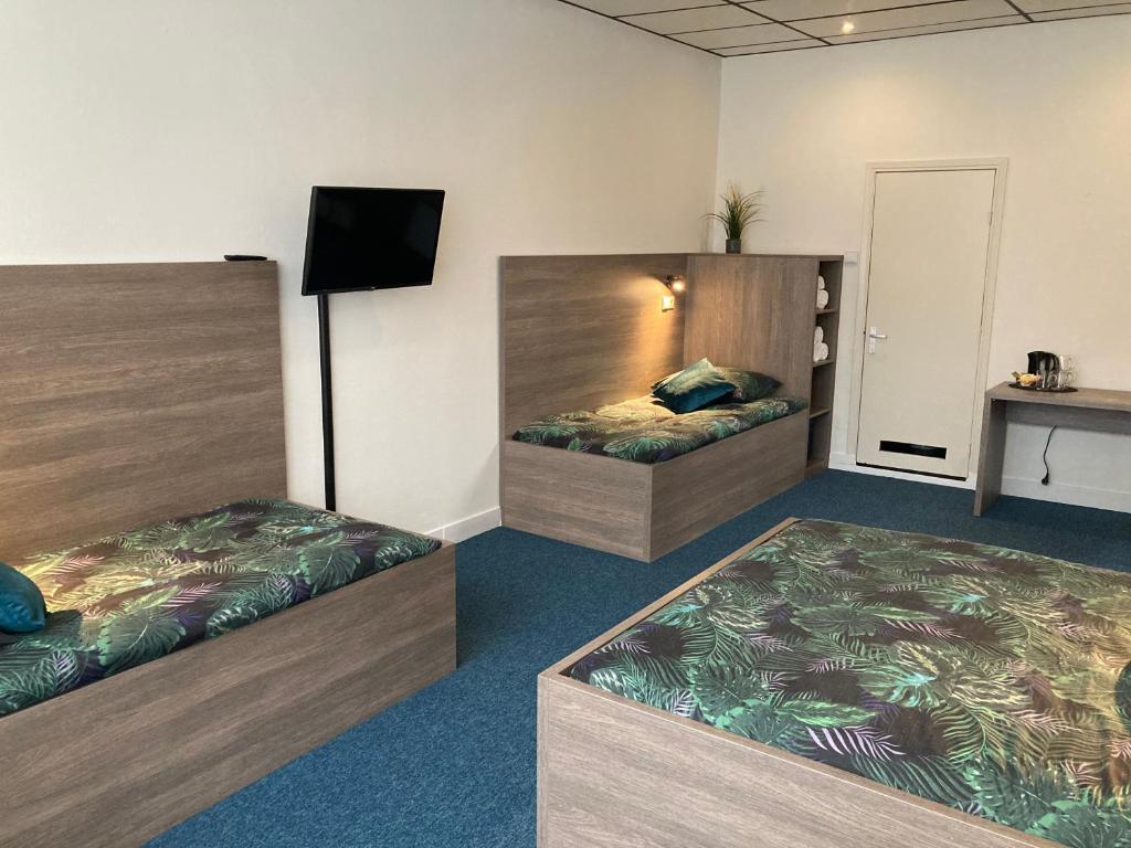 Postel nebo postele na pokoji v ubytování Hotel Poseidon