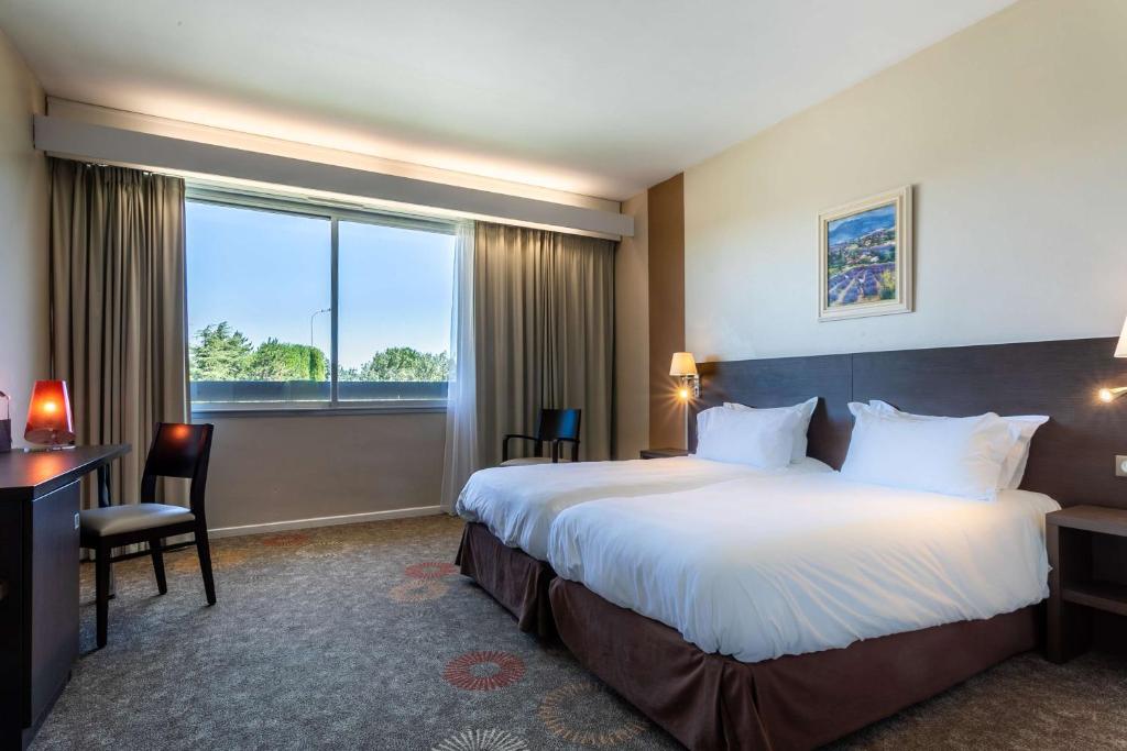 Postel nebo postele na pokoji v ubytování Best Western Sévan Parc Hôtel