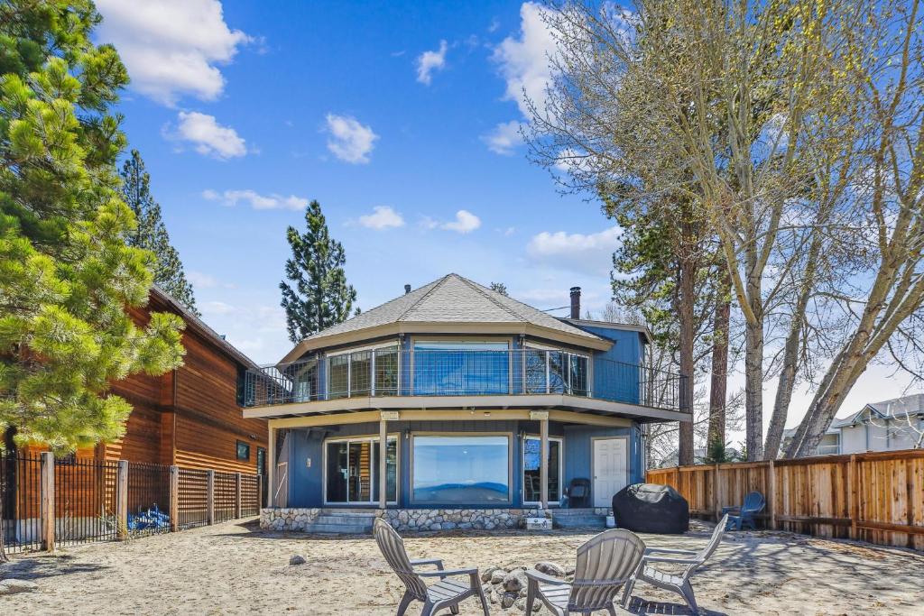 a house with two chairs and a fence at Private Beach, Pool Table, Close To Everything in South Lake Tahoe