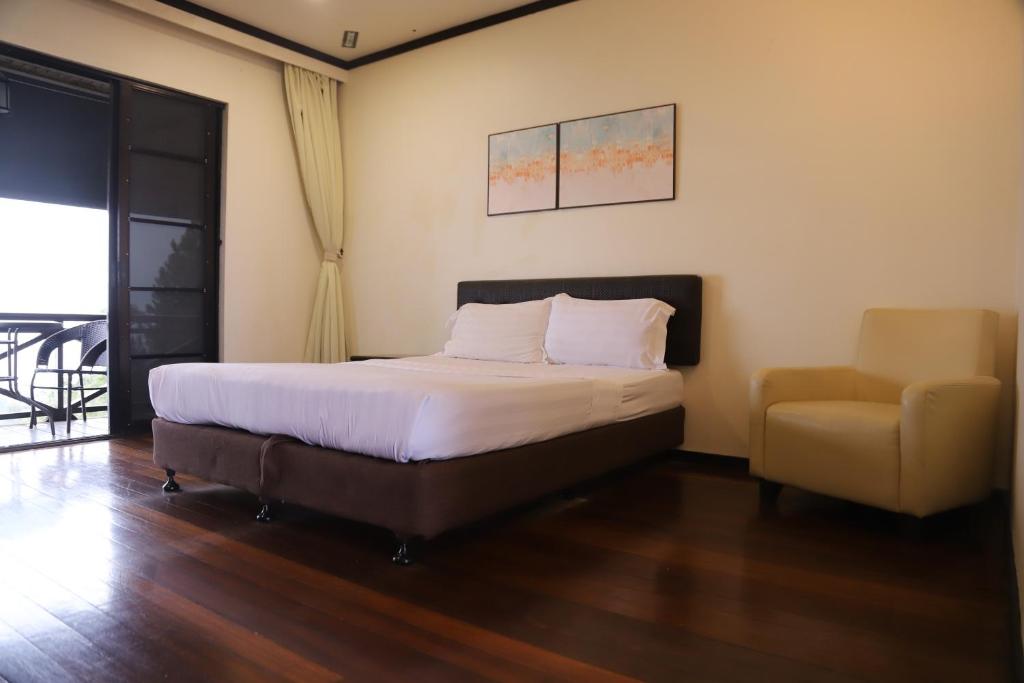 Postel nebo postele na pokoji v ubytování Kasih Sayang Hill Resort
