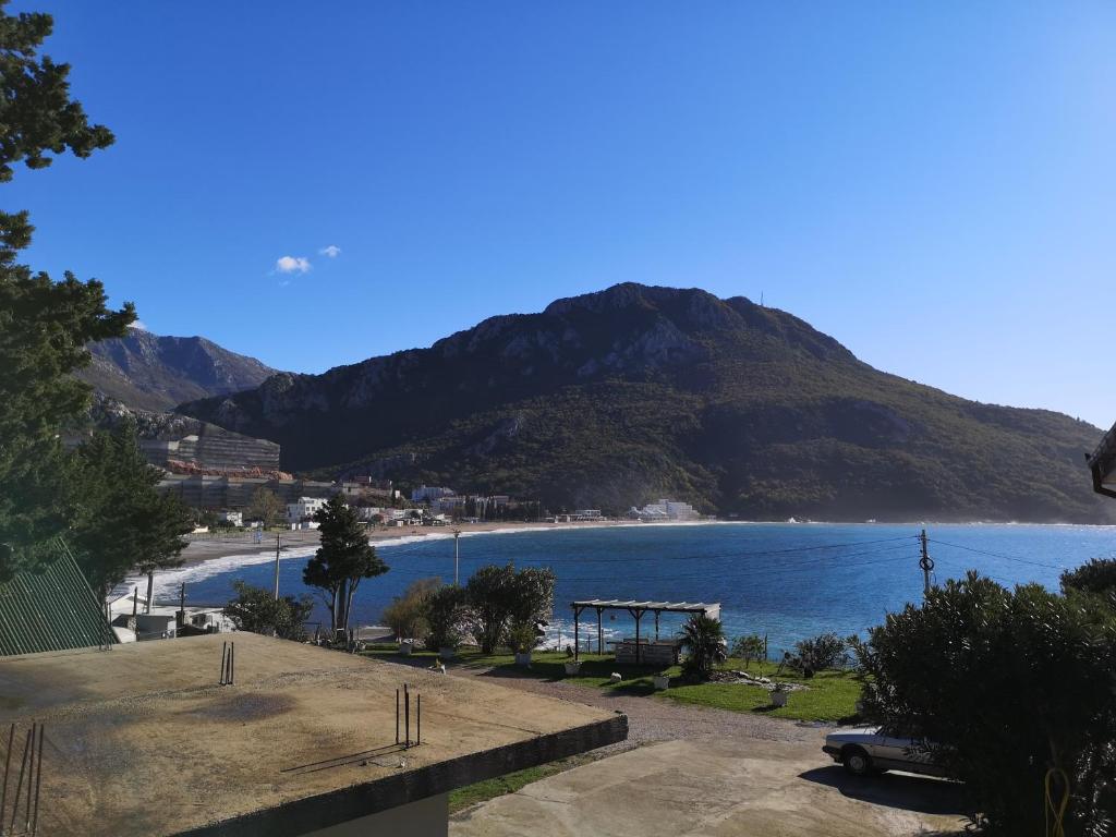 a view of a beach with a mountain in the background at Apartment AS in Čanj
