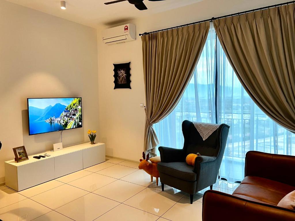 TV a/nebo společenská místnost v ubytování Ipoh Peaceful Onsen studio Lost World Tambun