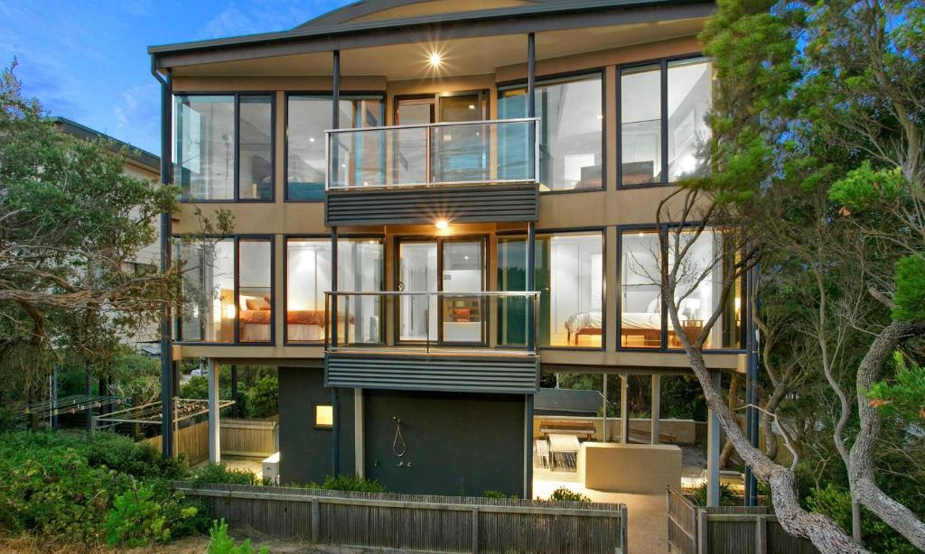 a large house with large glass windows on it at Belbourie in Queenscliff