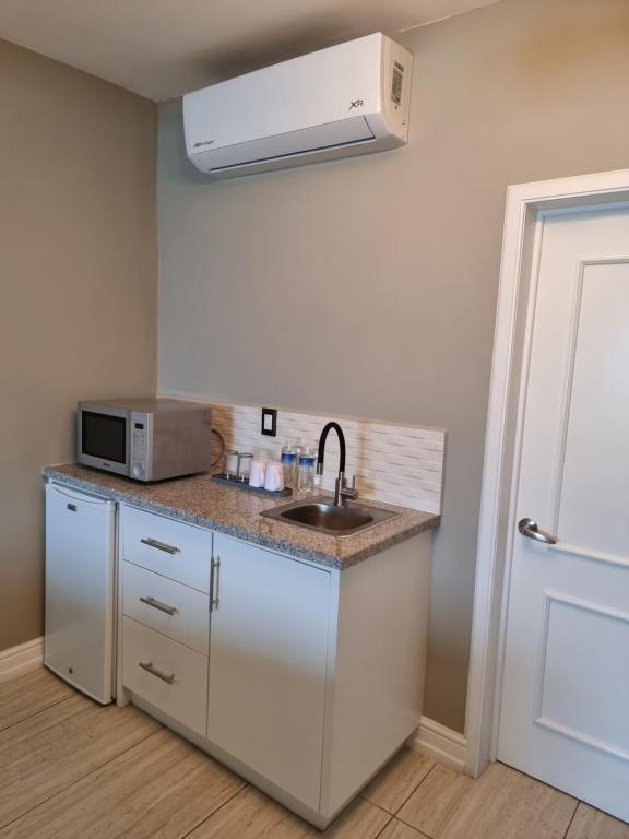 Kuchyň nebo kuchyňský kout v ubytování Casa Escamela Suites privadas