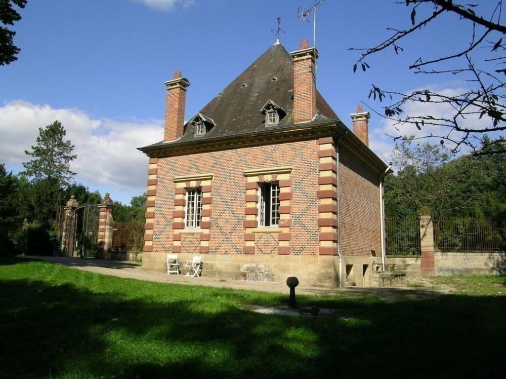 a brick building with two chimneys on top of it at Gîte Trévol, 5 pièces, 8 personnes - FR-1-489-223 in Trévol