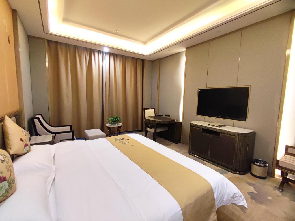 TV a/nebo společenská místnost v ubytování Zhangye KAI RUI Hotel