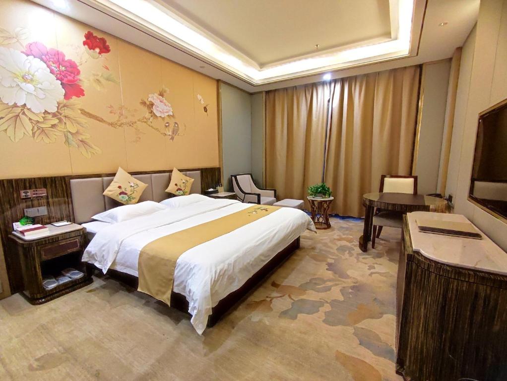 Postel nebo postele na pokoji v ubytování Zhangye KAI RUI Hotel