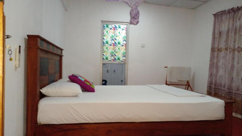 Postel nebo postele na pokoji v ubytování Pidurangala View Home Stay