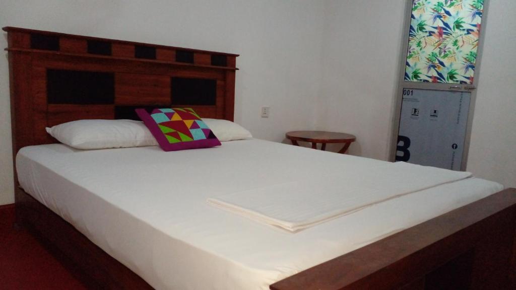 Postel nebo postele na pokoji v ubytování Pidurangala View Home Stay
