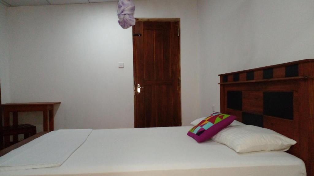 Postel nebo postele na pokoji v ubytování Pidurangala View Home Stay