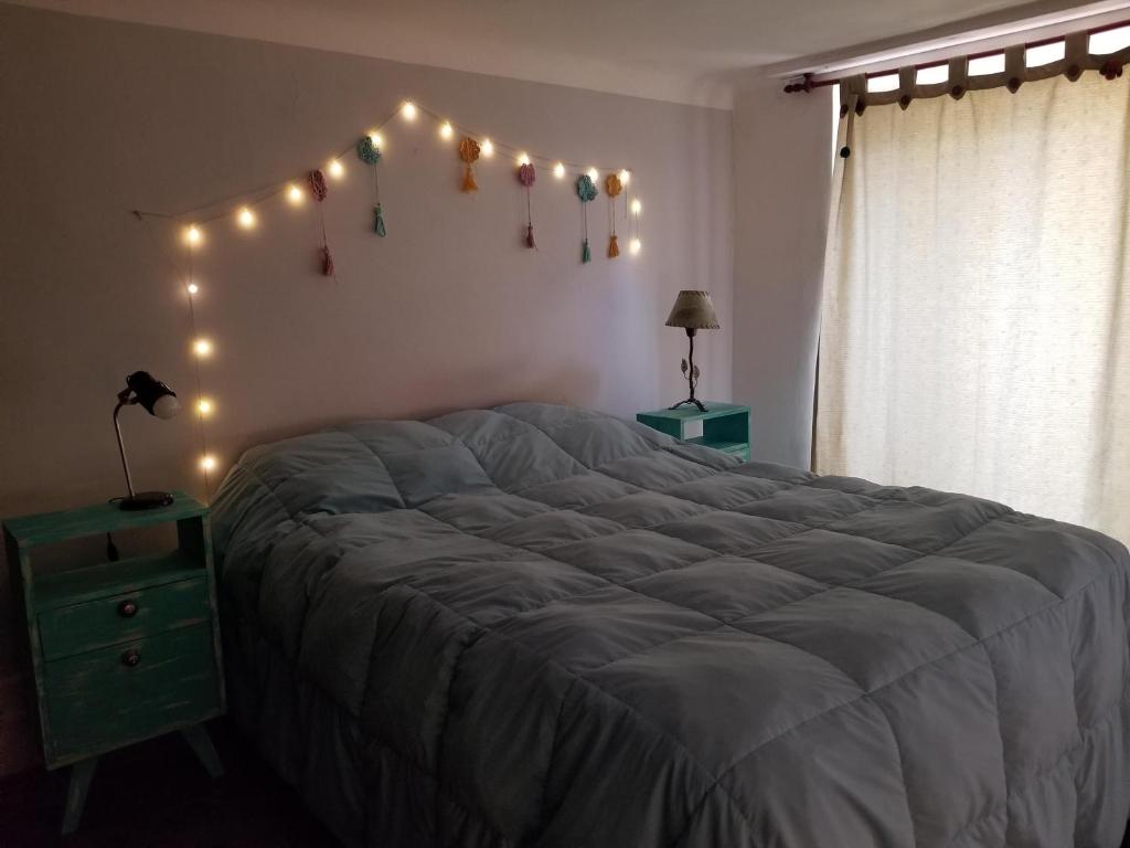 Una cama o camas en una habitación de Cute Home