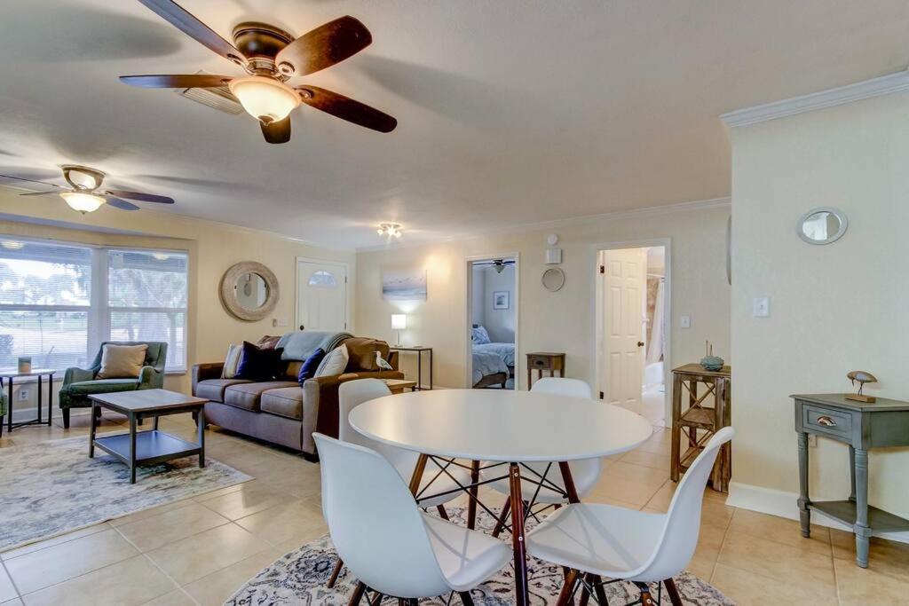 a living room with a ceiling fan and a table at Relaxing! Spacious 2 bedroom- close to everything! in Clearwater