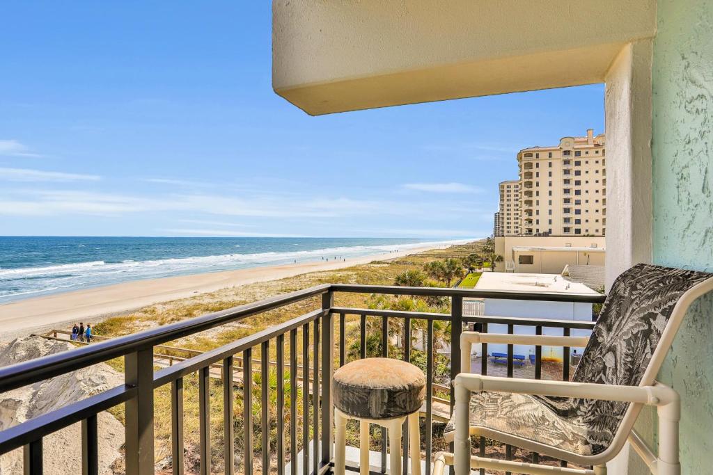 a balcony with a view of the beach at Beachside Surf Haven in Jacksonville Beach