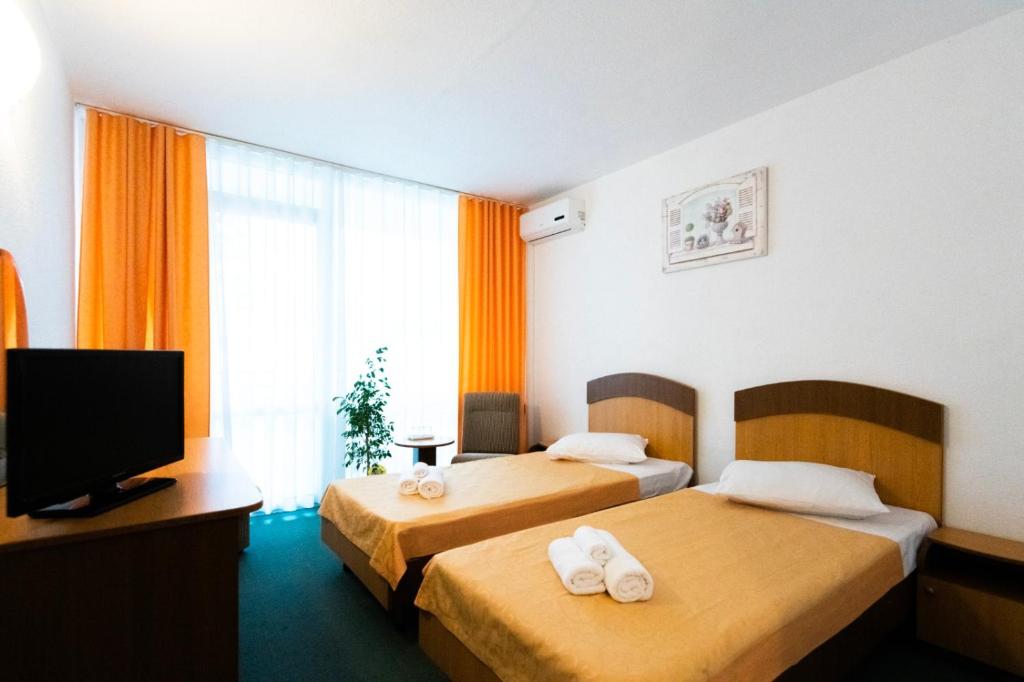 Postel nebo postele na pokoji v ubytování Hotel Siret Saturn